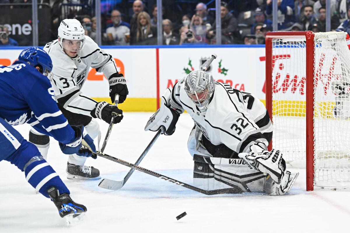Kings goalie Jonathan Quick makes a save on Toronto Maple Leafs center John Tavares during the third period.