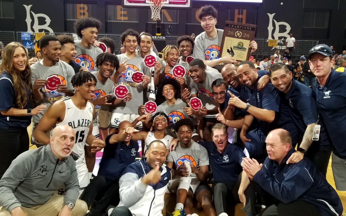 Sierra Canyon players and coaches gather for a photo after defeating Mater Dei for the Southern Section Open Division title on Feb. 28, 2020.