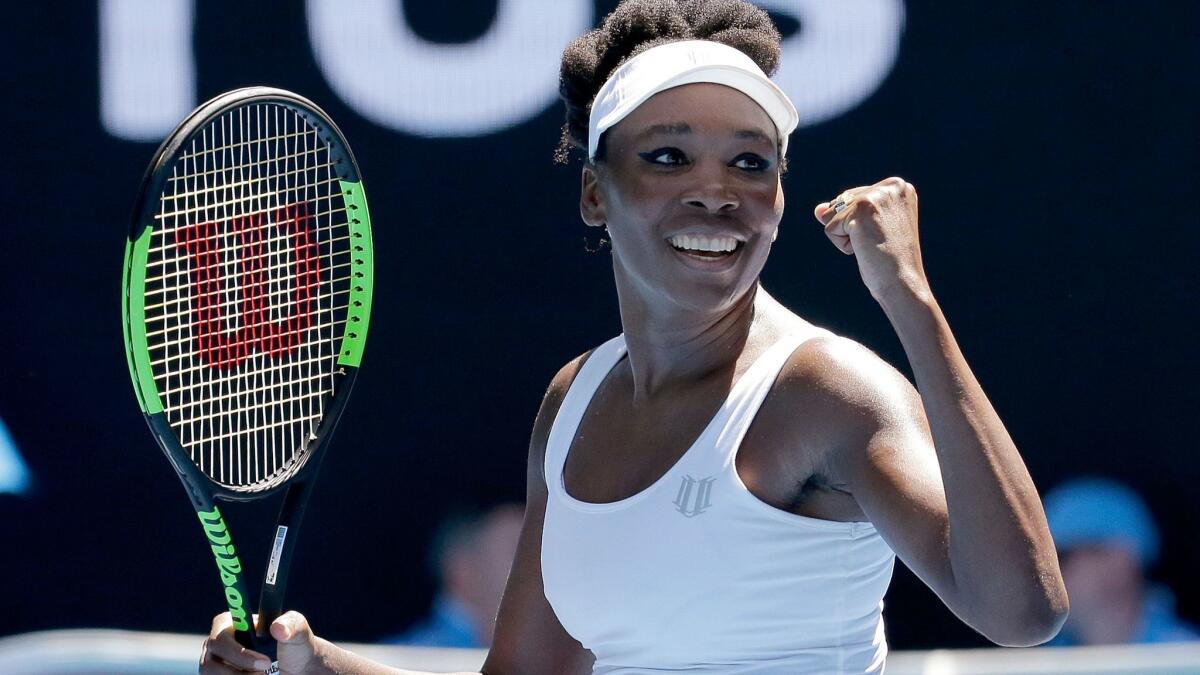 Venus Williams celebrates after defeating Kateryna Kozlova in their first-round match at the Australian Open on Monday.