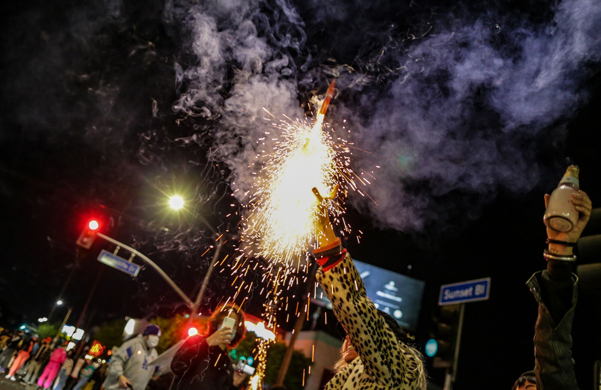 Erica Clum sets off fireworks celebrating Joe Biden's win in Los Angeles.
