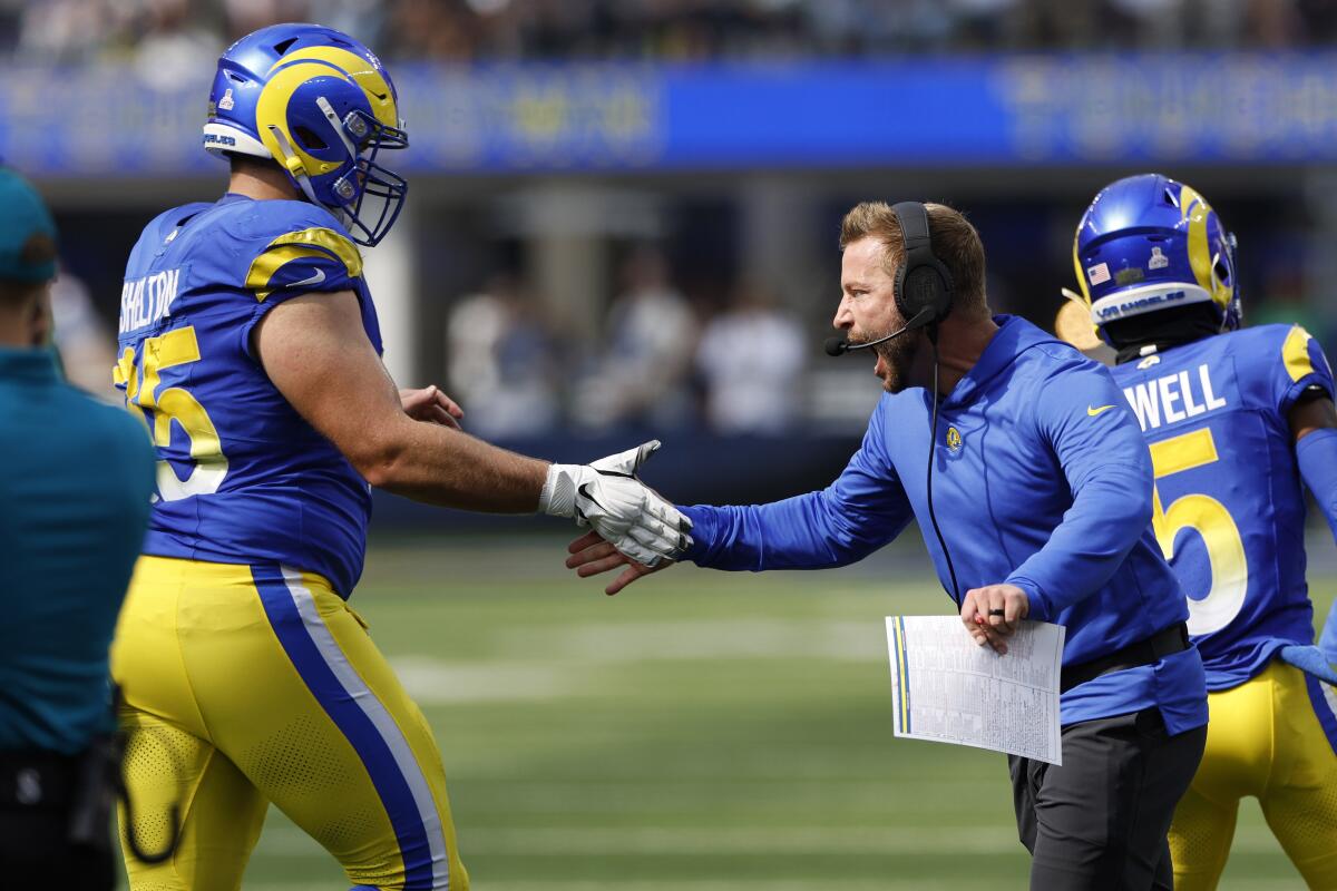 Rams coach Sean McVay celebrates with center Coleman Shelton after a Rams touchdown in the first half against the Eagles.