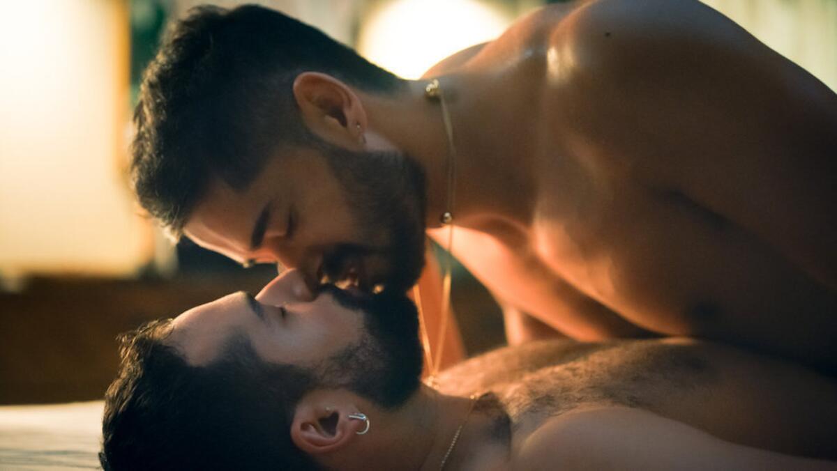 Two men about to kiss