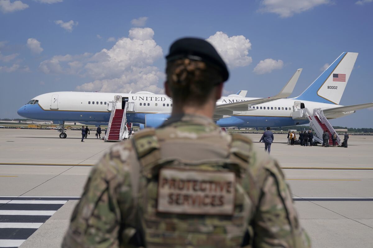 FILE - In this June 6, 2021, file photo a soldier stands guard near Air Force Two at Andrews Air Force Base, Md. About a third of the female service members in the Air Force and Space Force say they've experienced sexual harassment and many can describe accounts of sexism and a negative stigma associated with pregnancy and maternity leave, a study released Thursday, Sept. 9, has found. The review, done by the Air Force Inspector General, also concluded that minorities and females are underrepresented in leadership and officer positions, particularly at the senior levels, and get promoted less frequently. (AP Photo/Jacquelyn Martin, File)