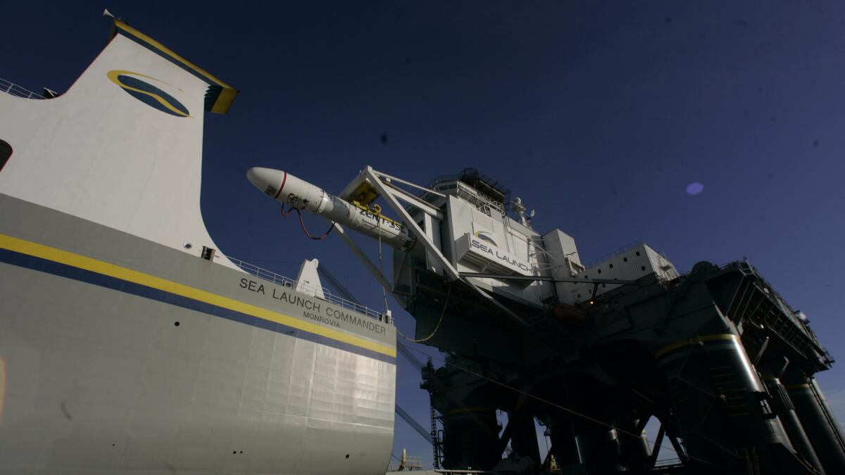 Sea Launch's satellite launch system, shown in 2006, includes a specially designed cargo ship and a launch platform erected on a modified oil rig.