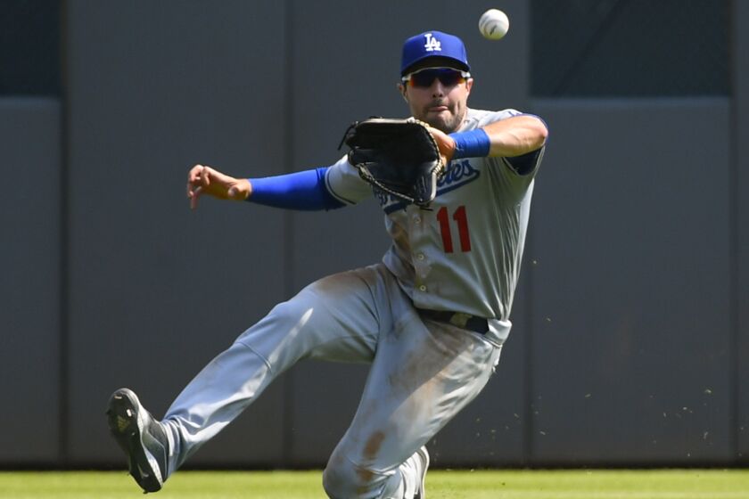 Los Angeles Dodgers center fielder A.J. Pollock catches a line drive of the bat of Atlanta Braves' Matt Joyce (14) during the seventh inning of a baseball game Sunday, Aug. 18, 2019, in Atlanta. (AP Photo/John Amis)