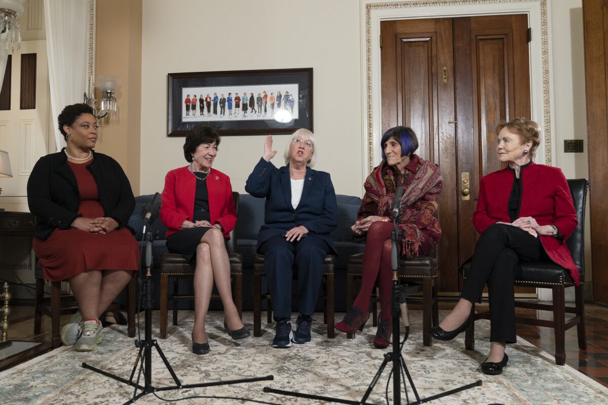 Shalanda Young, Susan Collins, Patty Murray, Rosa DeLauro and Kay Granger speak with The Associated Press on Thursday. 
