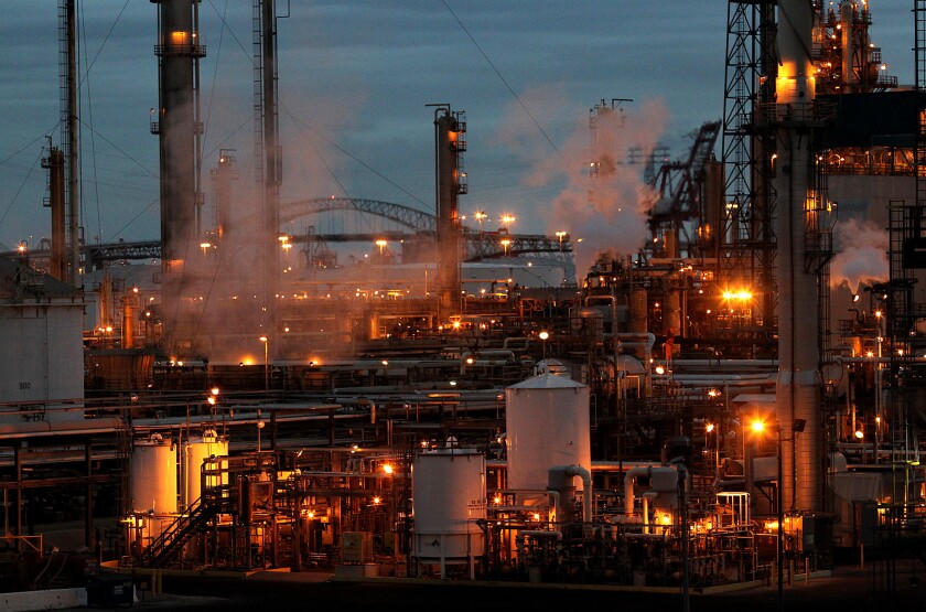 Valero's Wilmington refinery in 2010. Legislation by Sen. Fran Pavley (D-Agoura Hills) would put into law executive orders issued by Govs. Jerry Brown and Arnold Schwarzenegger to reduce greenhouse gas emissions.