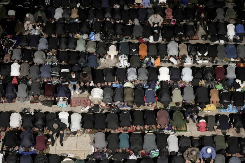 Muslims pray on Laylat al-Qadr, or night of power, that marks the last 10 days of the holy month of Ramadan, at the Al-Aqsa Mosque compound in Jerusalem's Old City, Friday, April 5, 2024. (AP Photo/Mahmoud Illean)