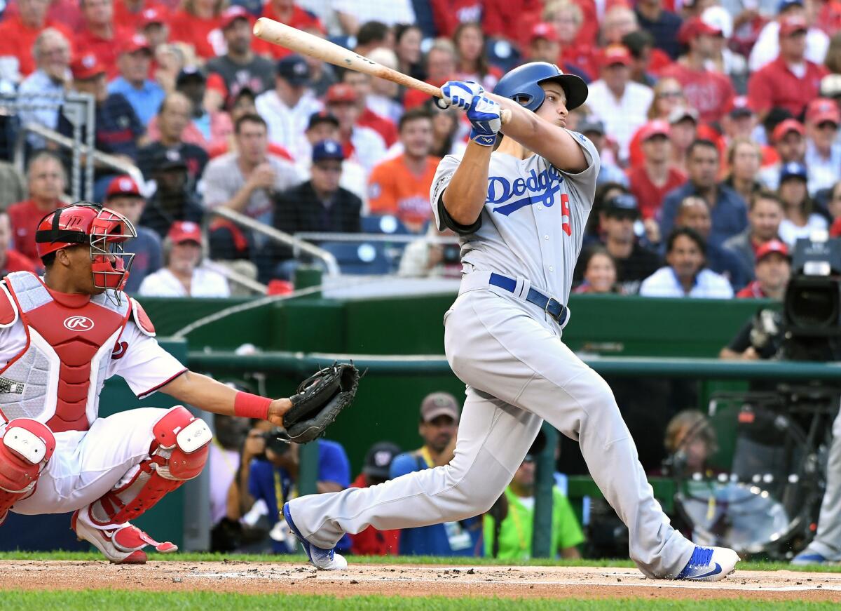 Dodgers shortstop Corey Seager follows through after hitting a home run against Washington in Game 1 of the NLDS on Friday at Nationals Park.
