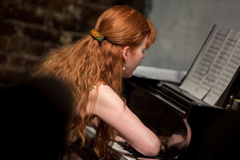 LOS ANGELES, --APRIL 04, 2017-- Pianist Sarah Cahill uses her forearms while performing a composition by California musical pioneer Lou Harrison, at Monk Space, in Los Angeles, CA, April 04, 2017. Cahill and Varied Trio performed as an early celebration of the Lou Harrison Centennial. (Jay L. Clendenin / Los Angeles Times)