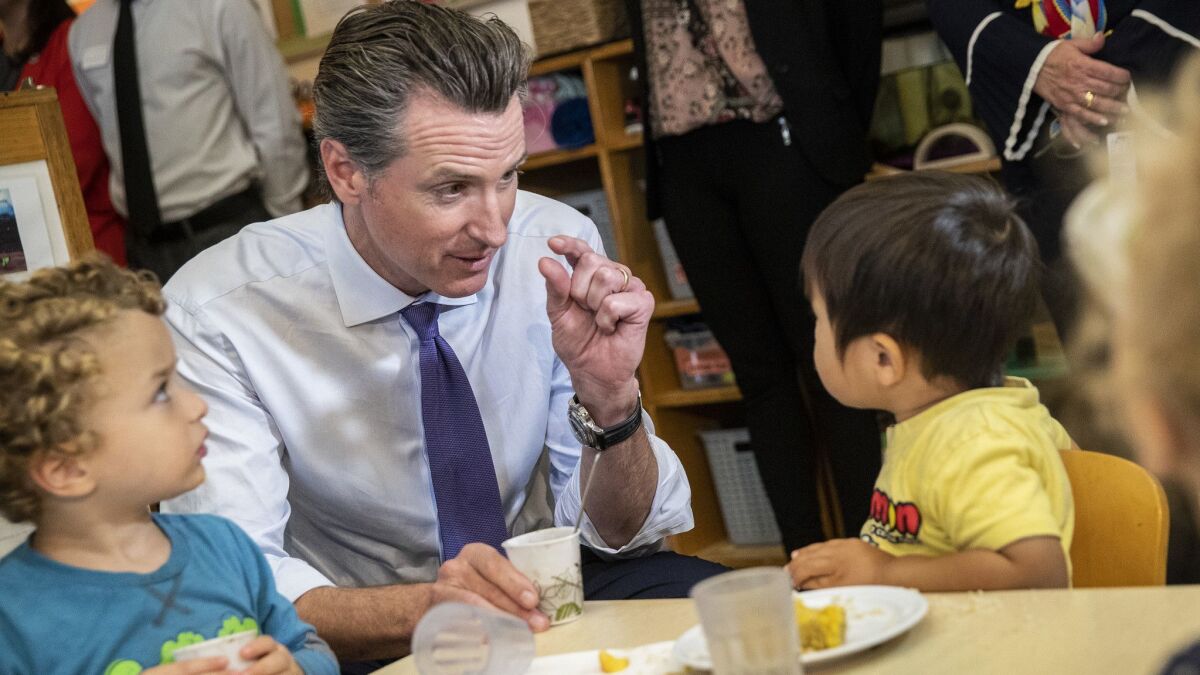 Gubernatorial candidate Gavin Newsom visits with children at UCLA's Early Care and Education Center at University Village in Los Angeles on Sept. 26.
