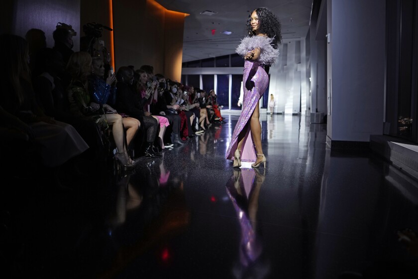 The Christian Cowan Fall/Winter 2022 collection is modeled at the One World Trade Center during New York Fashion Week on Friday, Feb. 11, 2022, in New York. (Photo by Charles Sykes/Invision/AP)