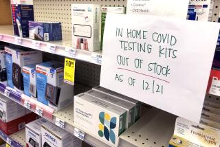 TORRANCE CA DECEMBER 21, 2021 - A sign indicates no COVID in-home testing kets were available at this Torrance CVS on Tuesday, December 21, 2021.. A surge of coronavirus cases tied to the Omicron variant ahead of Christmas weekend has prompted a crush of demand for the over-the-counter antigen tests that can be conveniently taken at home. (Christina House / Los Angeles Times)