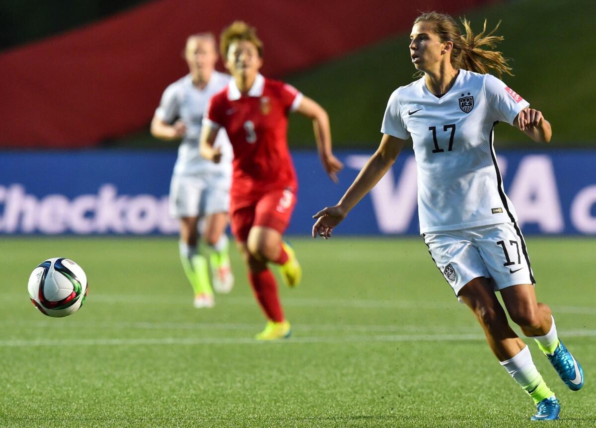 US player Tobin Heath looks to pass the ball during a 2015 FIFA Women's World Cup quarterfinal match between the US and China at Lansdowne Stadium in Ottawa, Ontario on June 26, 2015. AFP PHOTO/ NICHOLAS KAMMNICHOLAS KAMM/AFP/Getty Images ** OUTS - ELSENT, FPG - OUTS * NM, PH, VA if sourced by CT, LA or MoD **