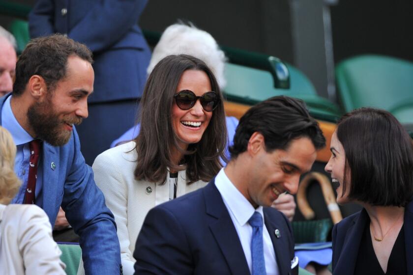 James Middleton and his sister Pippa Middleton, siblings to Catherine, the Duchess of Cambridge, chat with "Downton Abbey's" Michelle Dockery in the Royal Box on Centre Court just before the start of a Wimbledon match.