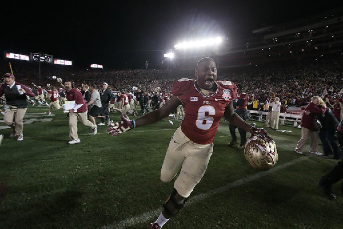 Florida State defensive end Dan Hicks storms the field in celebration immediately after the Seminoles' 34-31 victory over Auburn in the BCS championship game Monday at the Rose Bowl.
