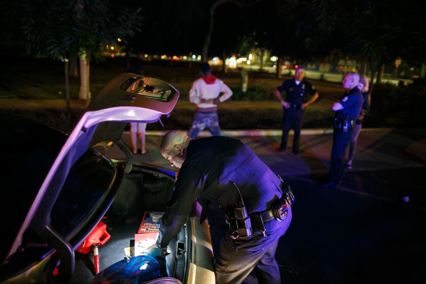 LOS ANGELES, CALIF. -- SATURDAY, NOVEMBER 21, 2015: Officers from the LAPD's newly expanded Metropolitan Division, stop drivers and search their vehicles in Los Angeles, Calif., on Nov. 21, 2015. (Marcus Yam / Los Angeles Times)