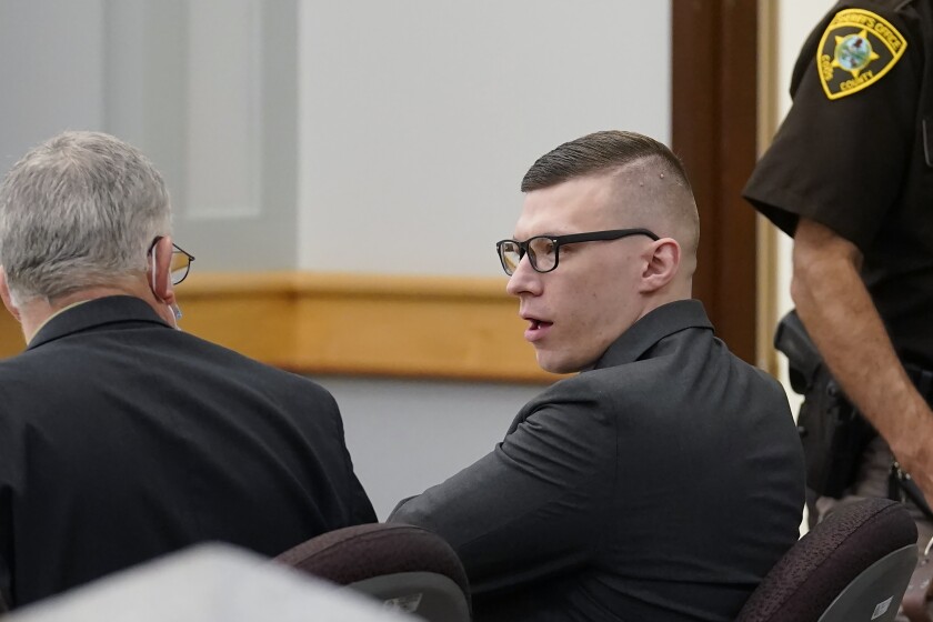 FILE - Volodymyr Zhukovskyy, of West Springfield, Mass., center right, charged with negligent homicide in the deaths of seven motorcycle club members in a 2019 crash, speaks with defense attorney Steve Mirkin, left, at Coos County Superior Court, in Lancaster, N.H., Monday, July 25, 2022. The prosecution has rested Zhukovskyy's case on Wednesday, Aug. 3. He faces negligent homicide and other charges in connection with the June 2019 crash in Randolph, New Hampshire (AP Photo/Steven Senne, Pool)