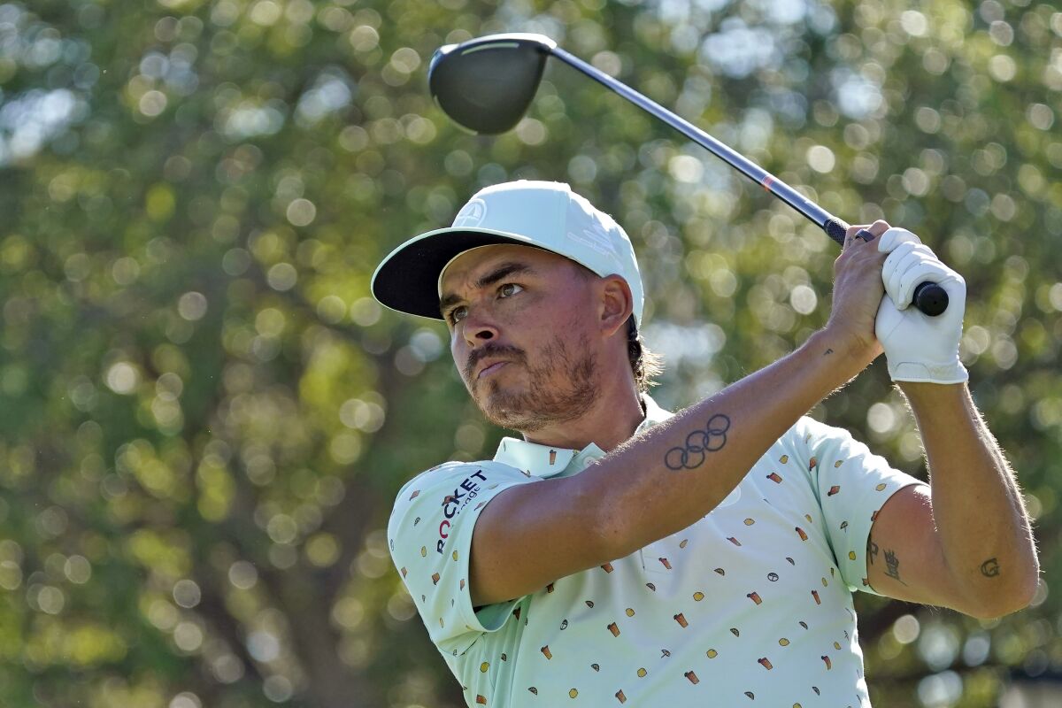 FILE- In this March 4, 2021, file photo, Rickie Fowler watches his tee shot on the 11th hole during the first round of the Arnold Palmer Invitational golf tournament in Orlando, Fla. Fowler goes into the PGA Championship next week in the most pronounced slump of his career. (AP Photo/John Raoux, File)