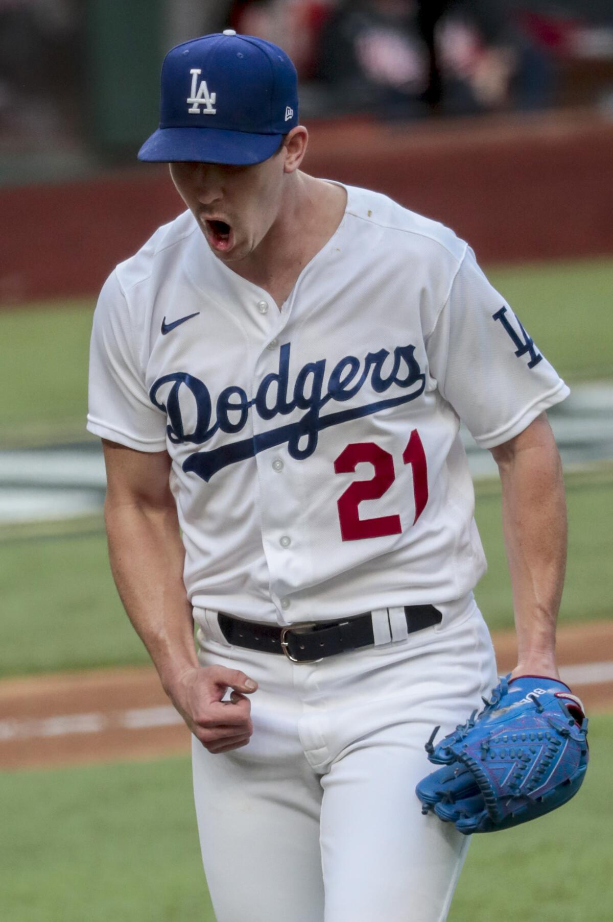 Walker Buehler celebrates after ending the sixth inning with a strikeout during the Dodgers' 3-1 win.