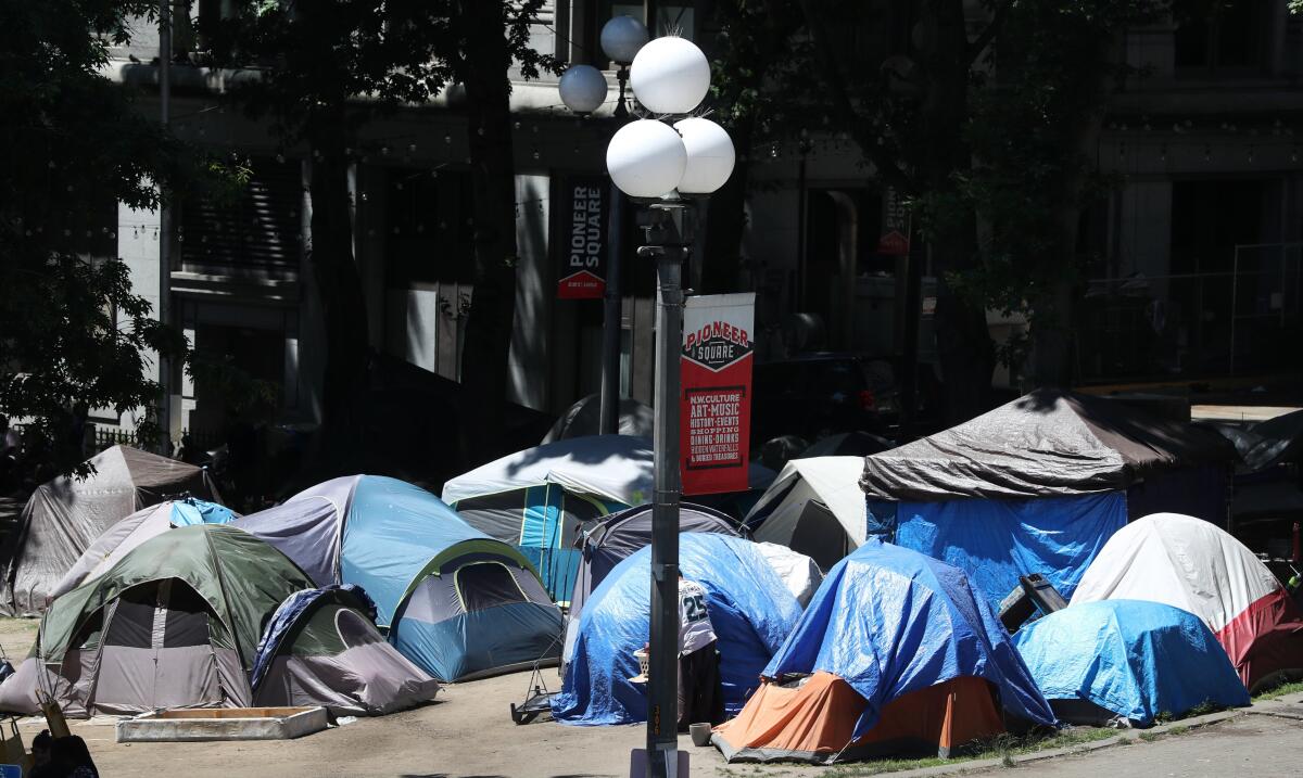 King County Council member Reagan Dunn has proposed legislation seeking to have the homeless encampment at City Hall Park, seen Tuesday, June 22, 2021, south of the King County Courthouse in Seattle, condemned as a public safety hazard. (Ken Lambert/The Seattle Times via AP)