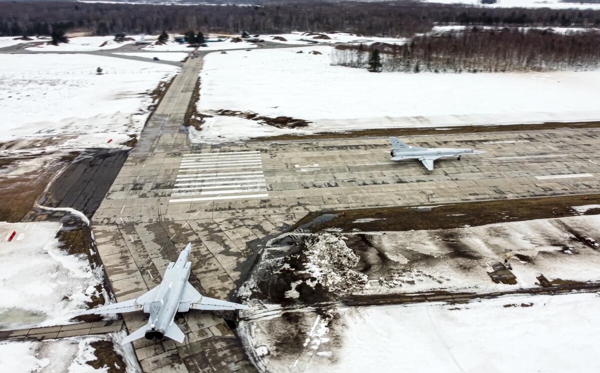 A pair of Tu-22M3 bombers of the Russian air force taxi before takeoff at an air base in Russia. 