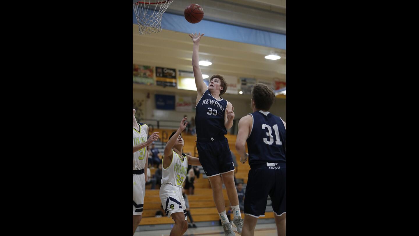 Newport Harbor High's Robbie Spooner (33) scores against Marina during the first half in a Sunset Conference crossover game at Marina High on Friday, December 21, 2018.