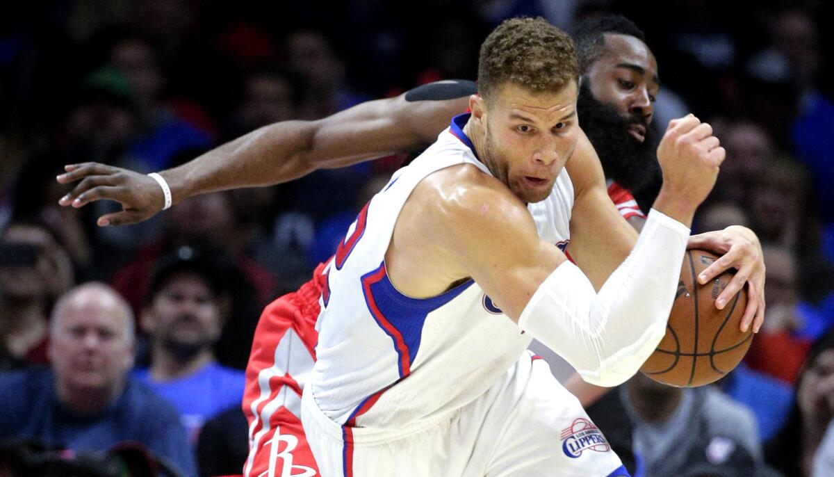 Clippers forward Blake Griffin steals the ball from Rockets guard James Harden during the first half of Game 6.