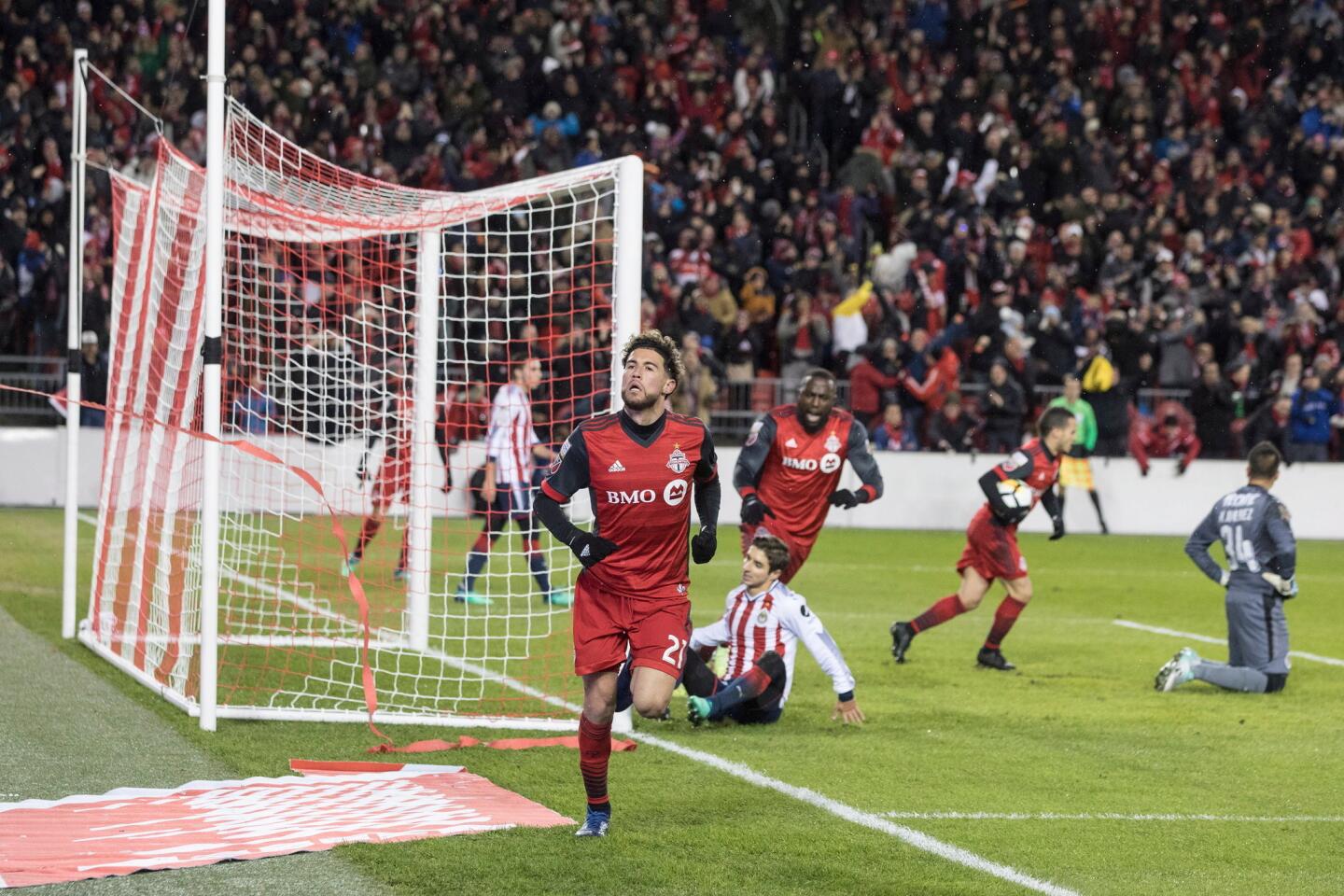 Toronto FC midfielder Jonathan Osorio (21) celebrates after scoring against Chivas of Guadalajara during the first half in the first leg of the CONCACAF Champions League soccer final, Tuesday, April 17, 2018, in Toronto. (Chris Young/The Canadian Press via AP)