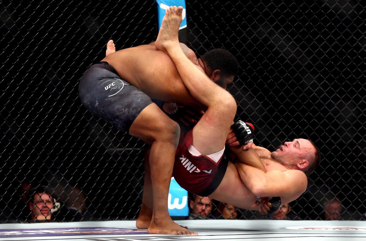 Curtis Blaydes slams Aleksei Oleinik to the canvas during their heavyweight bout at UFC 217.