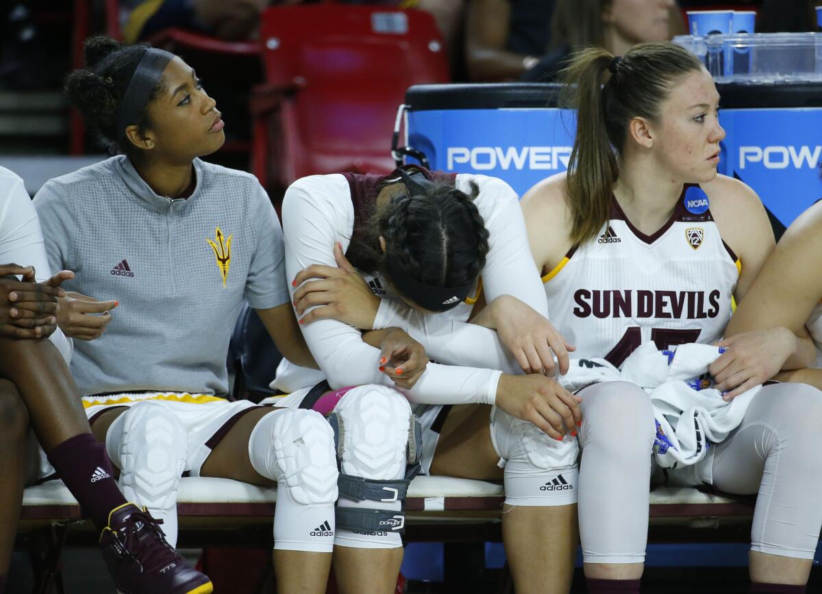 Arizona State players sit on the bench during the second half of a second-round NCAA tournament game against Tennessee.