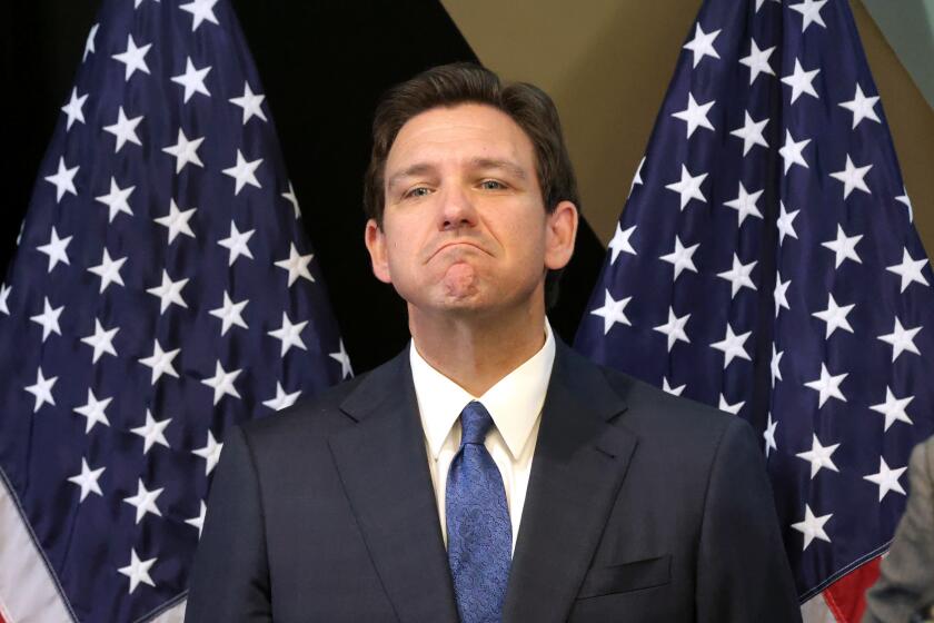 Florida Gov. Ron DeSantis listens to a question during a press conference at the headquarters of the former Reedy Creek Improvement District that a newly appointed board now calls the Central Florida Tourism Oversight District, in Lake Buena Vista, Florida, Monday, April 17, 2023. In an ongoing dispute with Disney Co., DeSantis said Monday that the Florida Legislature will reassert state control over the special taxing district that manages the municipal services of Walt Disney World. (Joe Burbank/Orlando Sentinel/Tribune News Service via Getty Images)
