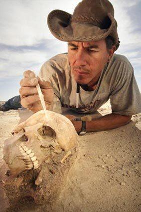 Paleontologist Paul Sereno of the University of Chicago stabilizes a nearly perfect preserved skull of a Tenerian, nomadic people that lived 6,500 to 4,500 years ago when the Sahara was an oasis.