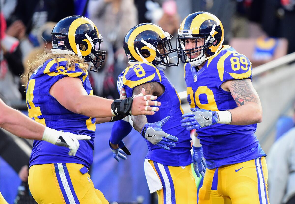 Rams tight end Tyler Higbee (89) celebrates with teammates after scoring a touchdown during the fourth quarter against the San Francisco 49ers on Dec. 24.
