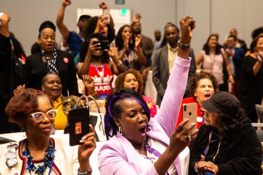 SAN FRANCISCO, CALIF. - MAY 31: People attending the "Black Women's Meetup," hosted by "African American Women Delegates," cheer while Kimberly Ellis speaks on the first day of the 2019 California State Democratic Party Convention at Moscone Center on Friday, May 31, 2019 in San Francisco, Calif. The convention will see 3,500 delegates, and will hear from 14 Democratic candidates for U.S. President and from Democratic leaders. (Kent Nishimura / Los Angeles Times)