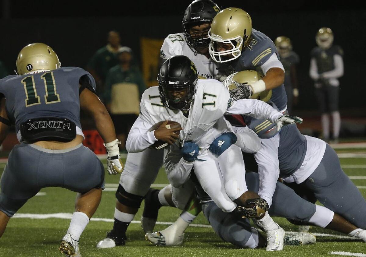 Jalen Chatman of Narbonne runs in an early season game against Long Beach Poly.