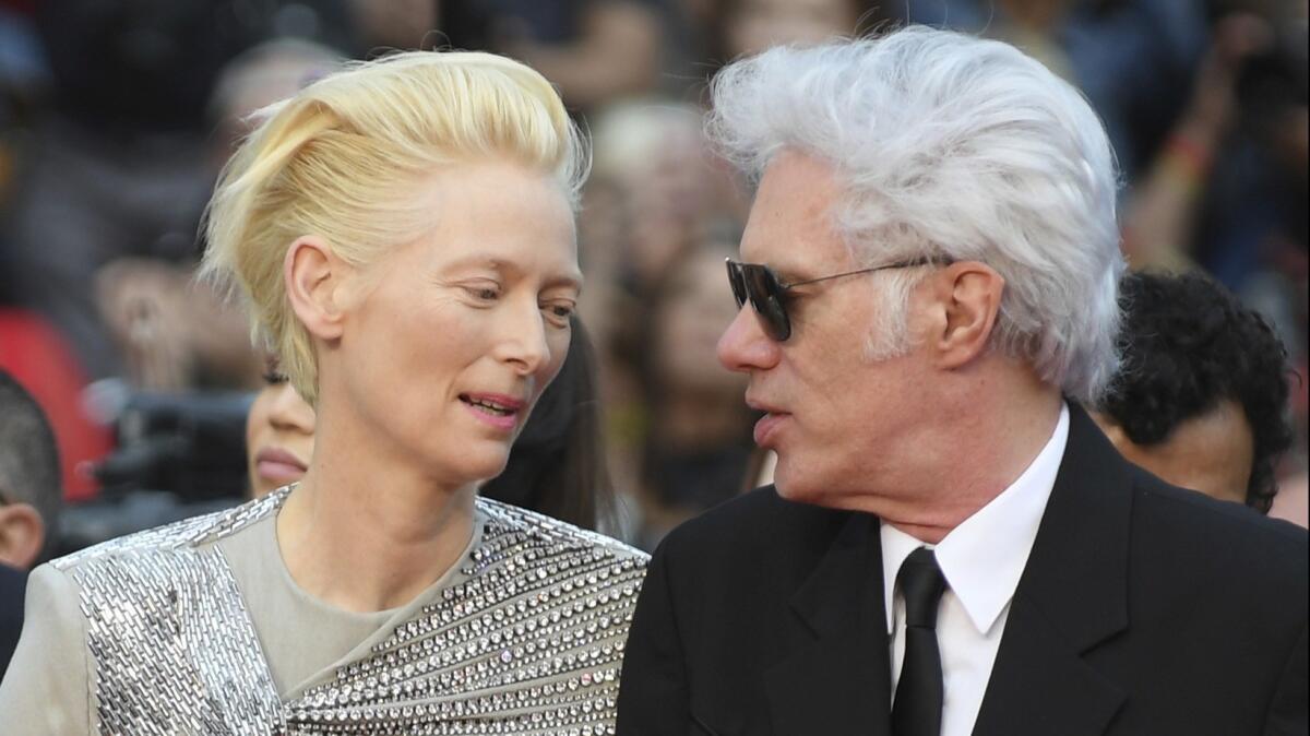 Tilda Swinton and director Jim Jarmusch on the red carpet at Cannes.