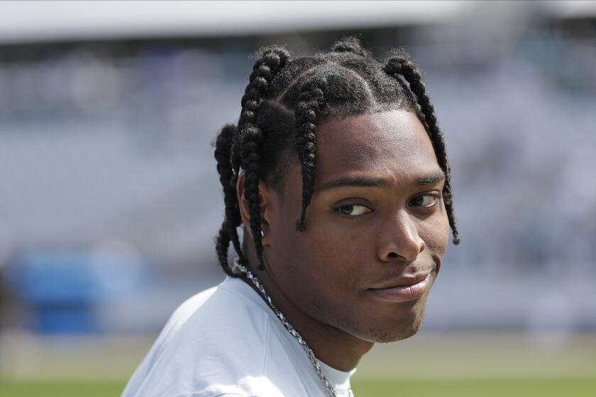 Jacksonville Jaguars cornerback Jalen Ramsey watches teammates warm up before an NFL football game against the New Orleans Saints, Sunday, Oct. 13, 2019, in Jacksonville, Fla. (AP Photo/John Raoux)