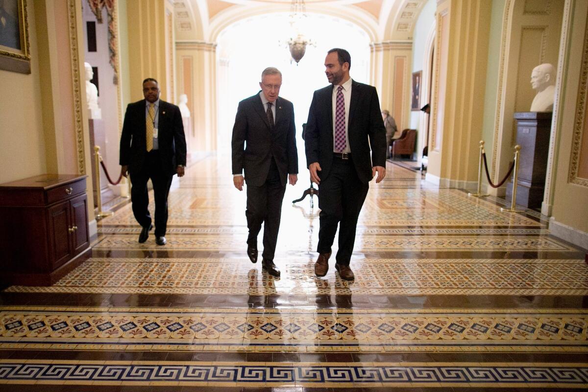 Senate Majority Leader Harry Reid (D-Nev.), center, in the Capitol on Monday. The Senate confirmed President Obama's remaining nominee to the influential D.C. Circuit Court of Appeals. The vote was 55 to 43.