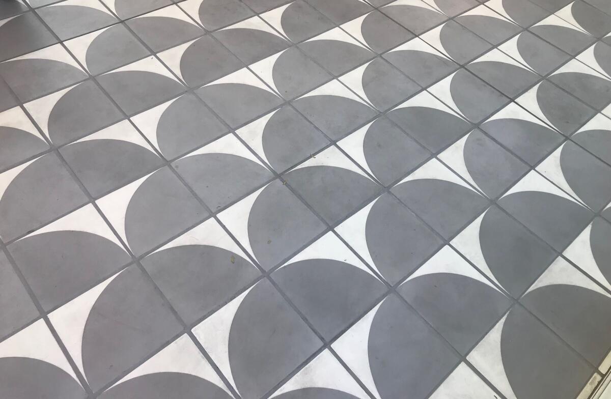 A geometric tile floor, inspired by the circular shape of the Mark Taper Forum, at Go Get Em Tiger.