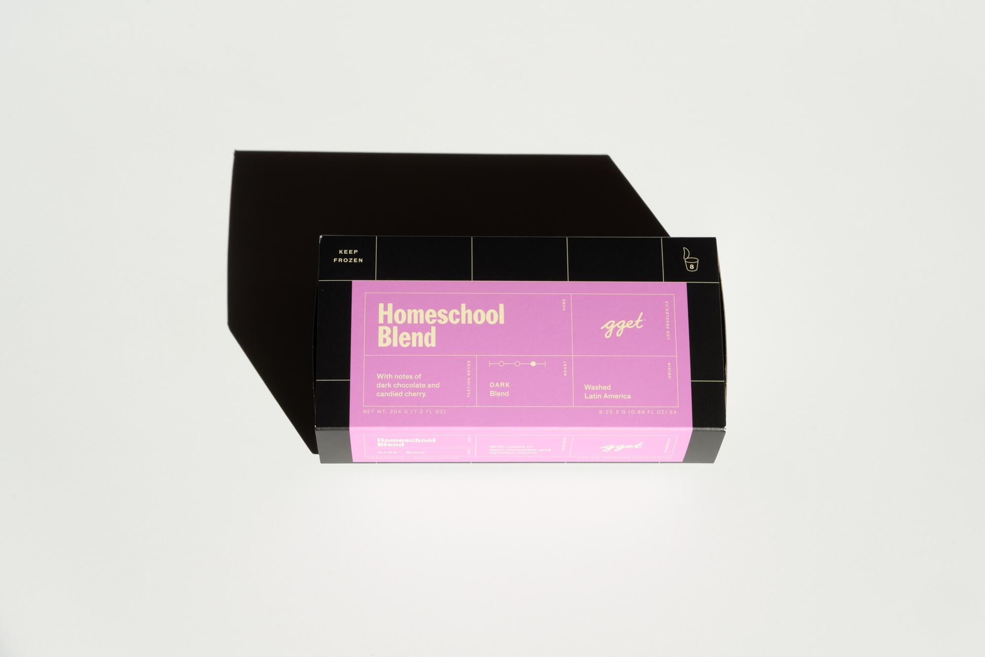 A black box with a pink label