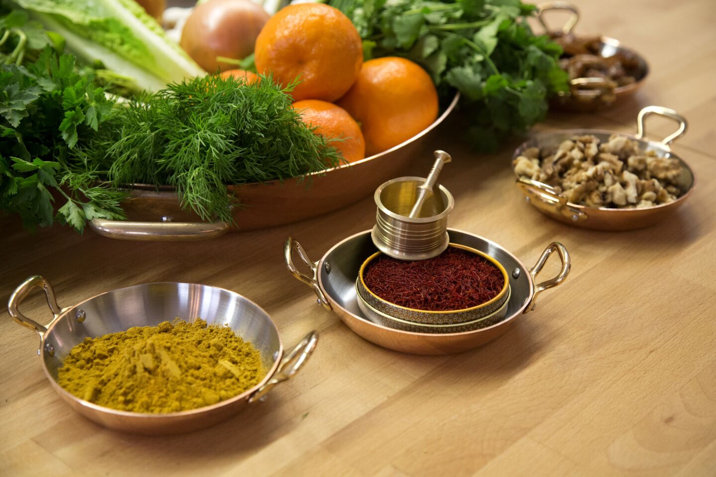 A selection of herbs and other ingredients, including a Persian spice blend and saffron, will go into making dishes for the Persian New Year.