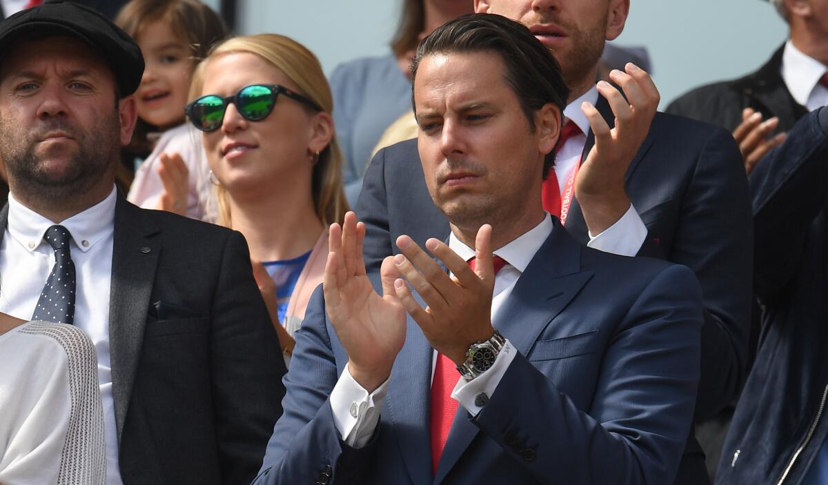 Josh Kroenke claps before a match between Arsenal FC and Burnley FC at Emirates Stadium in London on Aug. 17.