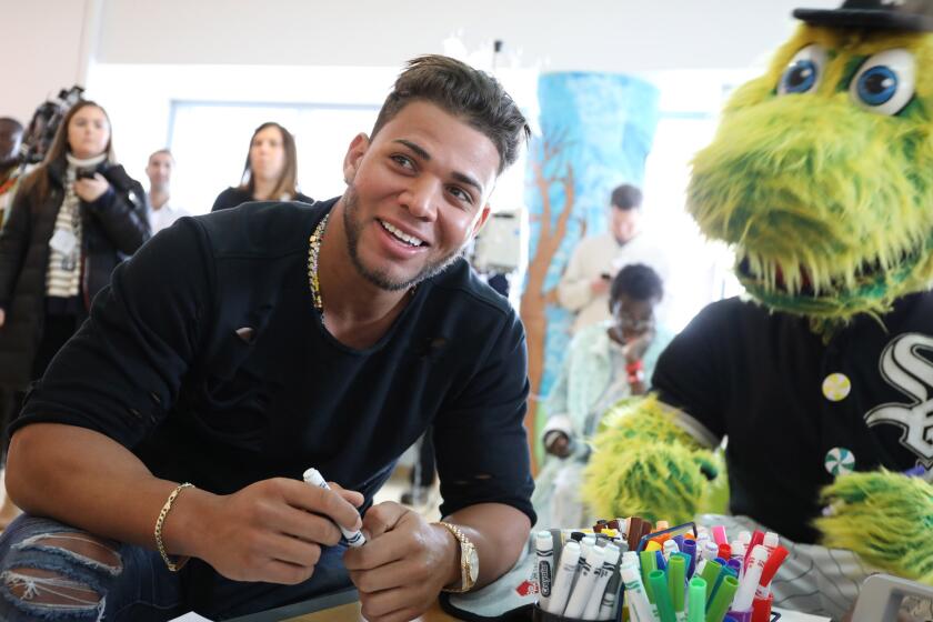Yoan Moncada signs autographs at Lurie Children's Hospital.