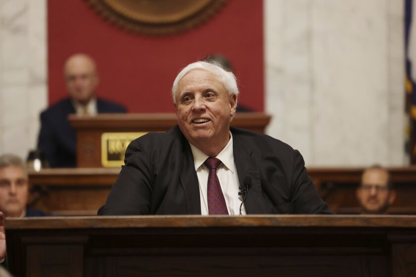 FILE - West Virginia Gov. Jim Justice delivers his annual State of the State address in the House Chambers at the state Capitol in Charleston, W.Va., Jan. 11, 2023. (AP Photo/Chris Jackson, File)