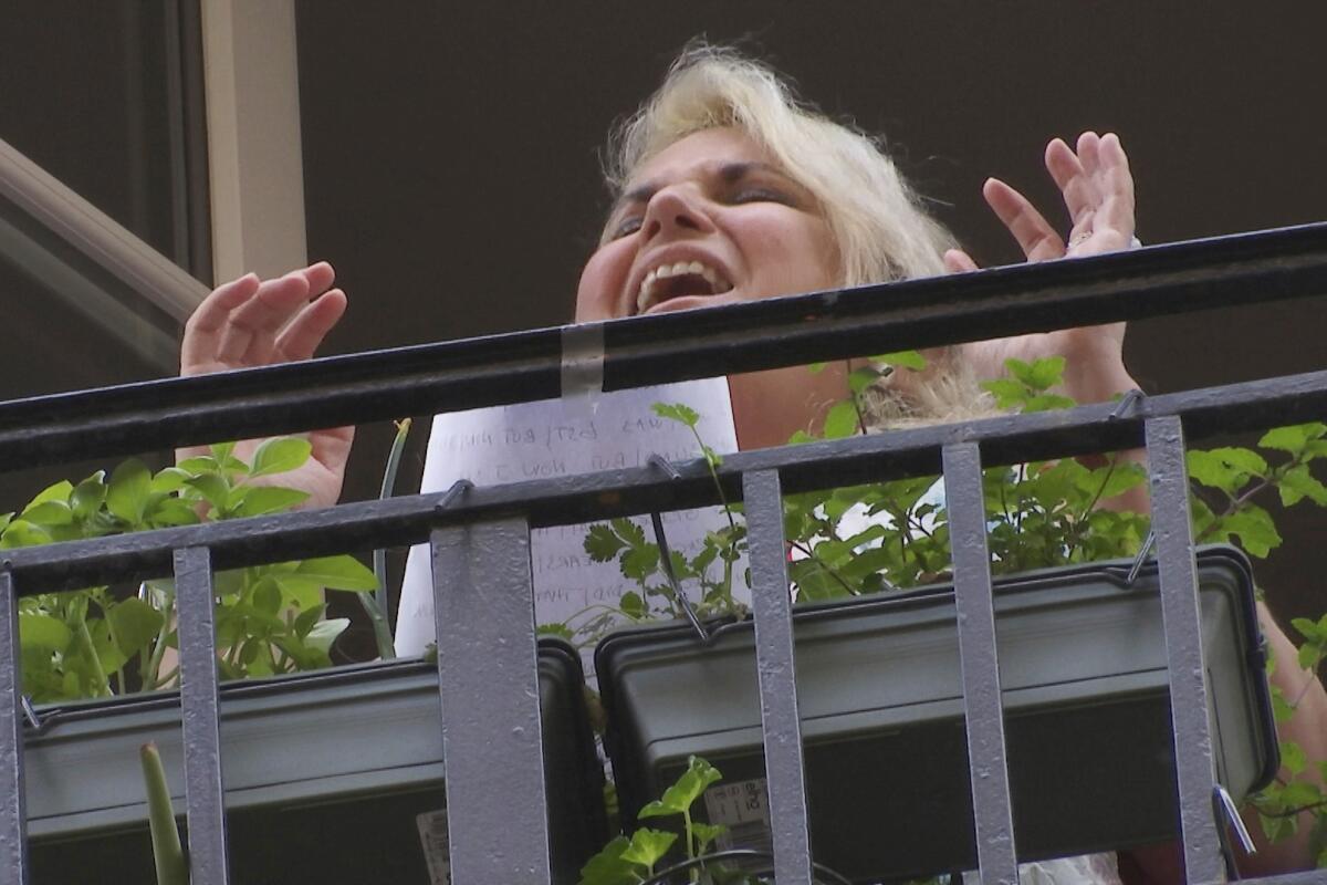 Veronica Antonelli sings from her balcony in Paris.