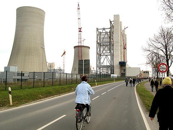 Massive towers dominate a power plant under construction in Neurath, Germany, near Grevenbroich, a town that downplays its reputation as the carbon emissions capital of Europe by reminding visitors, with signs around town, that it is also Germanys energy capital.