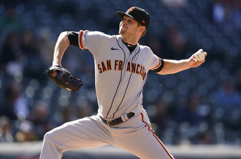 San Francisco Giants relief pitcher Sam Selman works against the Colorado Rockies during the fifth inning of a baseball game Wednesday, May 5, 2021, in Denver. (AP Photo/David Zalubowski)