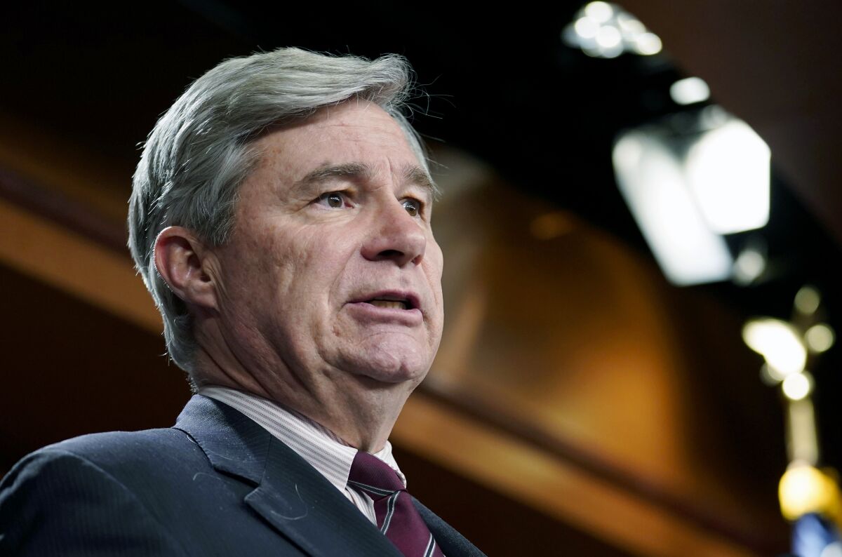 FILE - Sen. Sheldon Whitehouse, D-R.I., speaks to reporters at the Capitol in Washington, April 6, 2022. A Senate hearing on Wednesday, May 4, 2022 is likely to produce fireworks as Republicans and Democrats square off over the role that foundations and nonprofits are playing in elections. Whitehouse wants to raise concerns about “dark money” flowing through 501(c)(4) nonprofits, but Republicans plan to widen the scope of the hearing to highlight what they see as illegal political activities by 501(c)(3) charities and foundations. (AP Photo/Mariam Zuhaib, file)