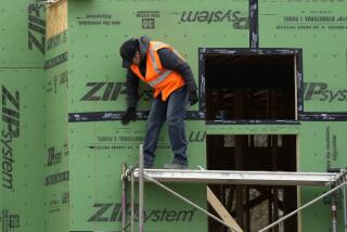 FILE - A construction worker secures sheathing at a residential building site in Mount Prospect, Ill., on March 18, 2024. (AP Photo/Nam Y. Huh, File)